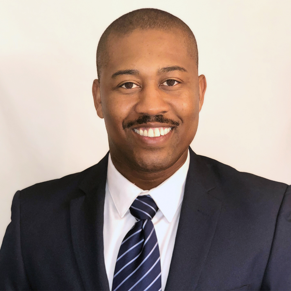 A headshot of Troy Elam, MBA