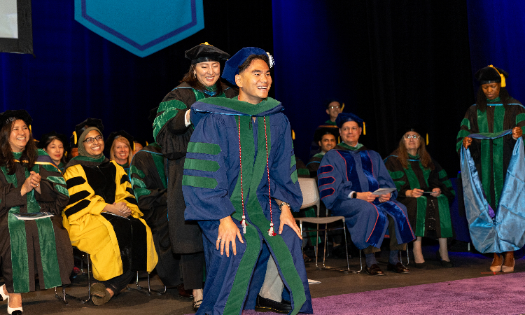 The KPSOM Commencement 2025 hooding ceremony.