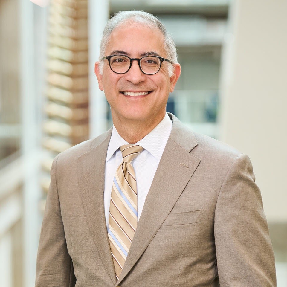 A headshot of John L. Dalrymple, MD