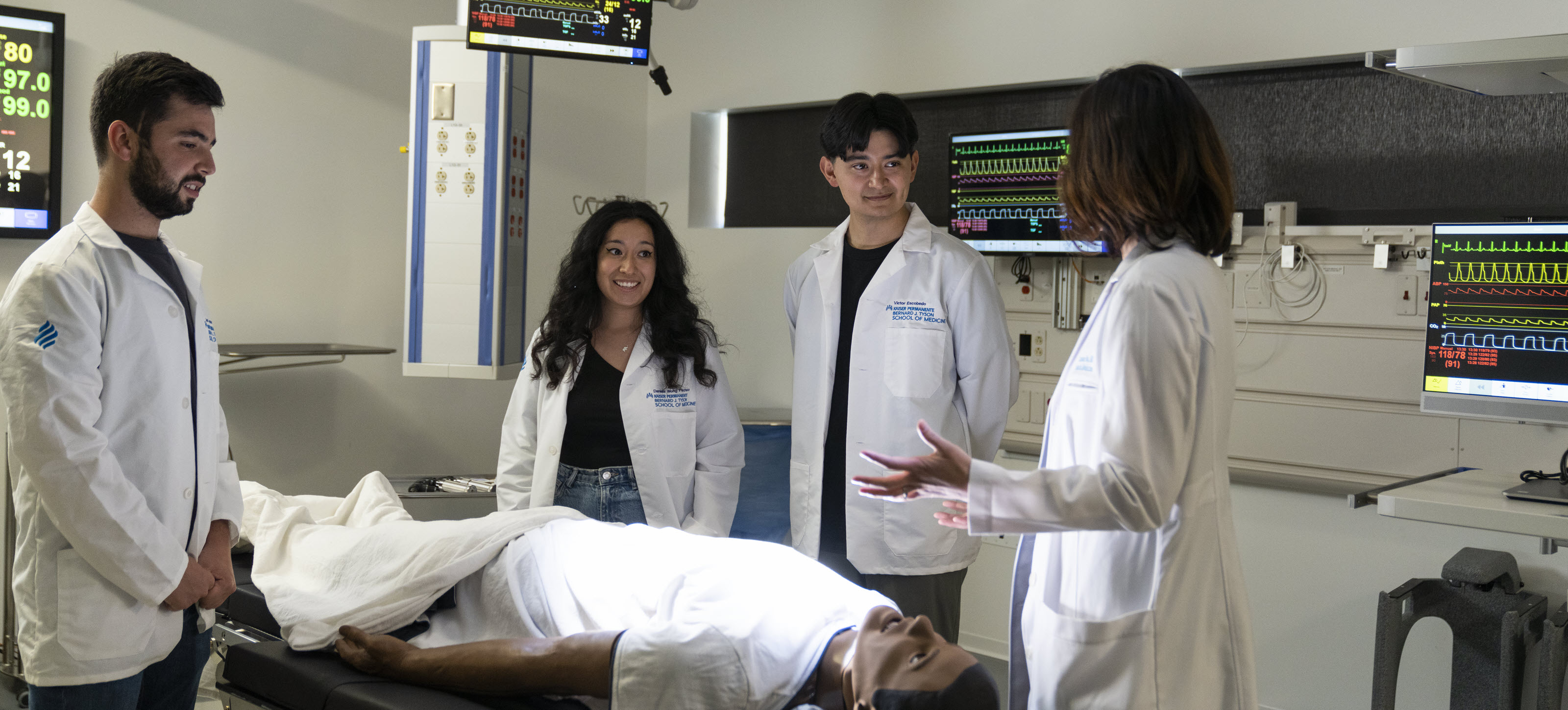 Four medical students in the Simulation Center.