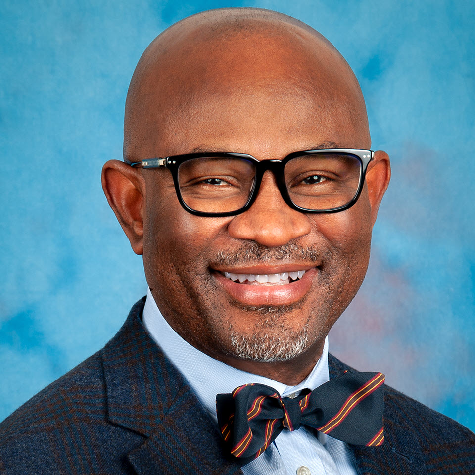 Profile headshot of Nkem Chukwumerije, MD, MPH, FACP