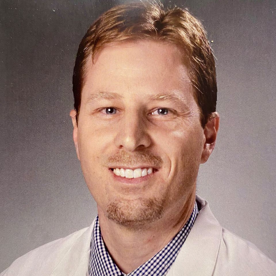 Profile headshot of Robert D. Huggins, MD