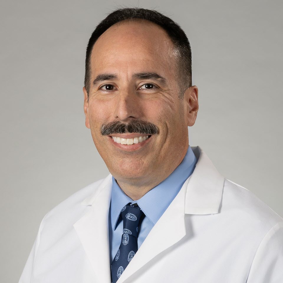 A headshot of Gabriel E. López, MD