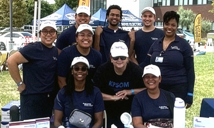 KPSOM Senior Director of Development Elizabeth Weinberg (center) is joined by KPSOM students, staff, and leaders at the 2025 ComptonFest.