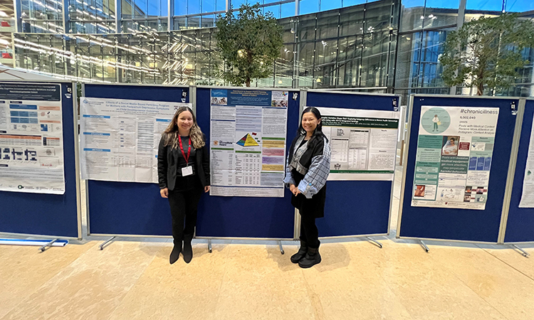 Dr. Joyce Javier (at right) is pictured with her mentee and co-poster presenter Dr. Karen Camero.