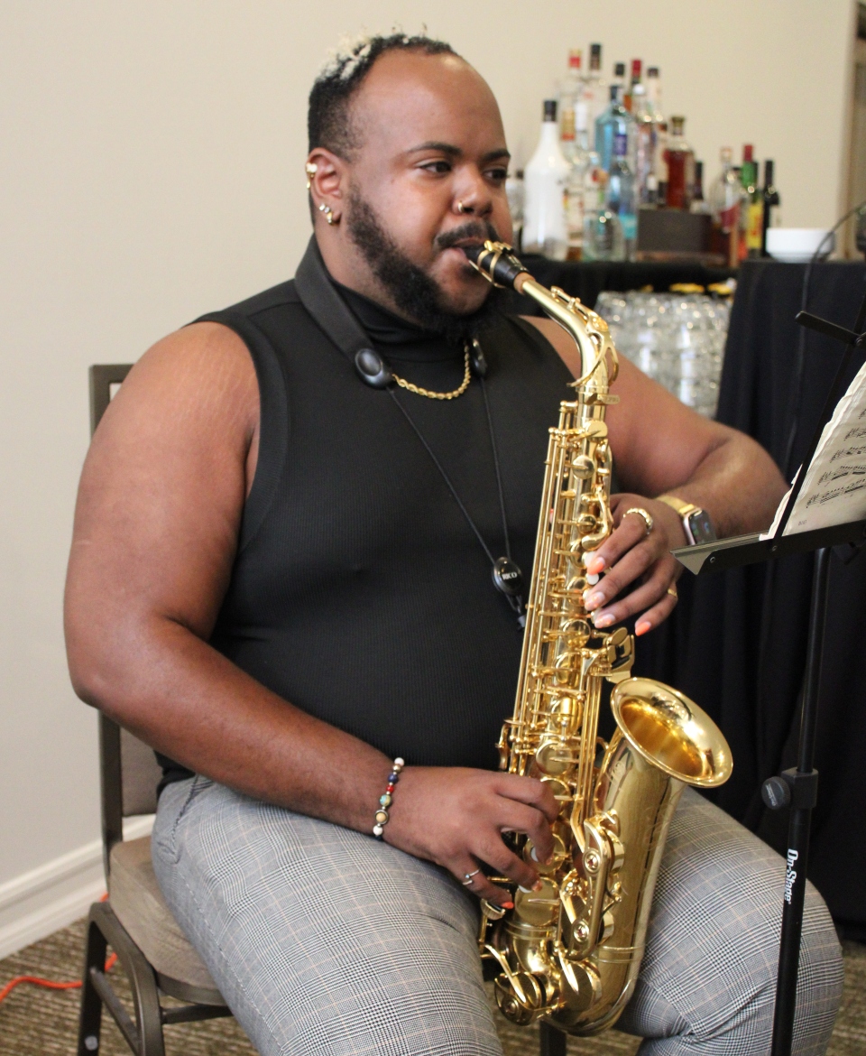 KPSOM student Jason Scott performs at the conference.