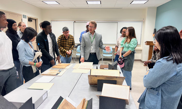 Dr. Klein guides students through The Huntington's collection of historic medical texts.