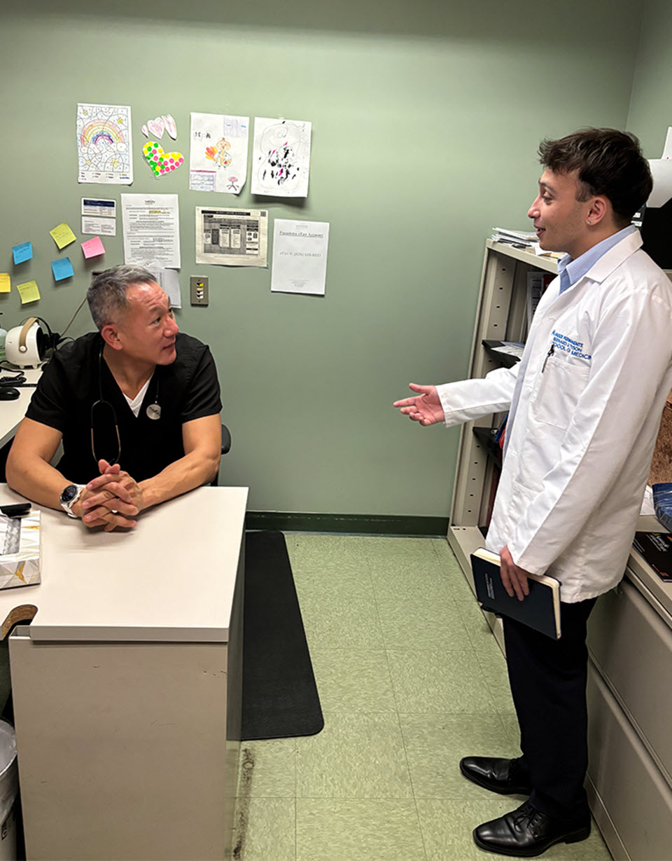 Faculty adviser Dr. John Su and student Boston Lutfi at the Student-Run Clinic.