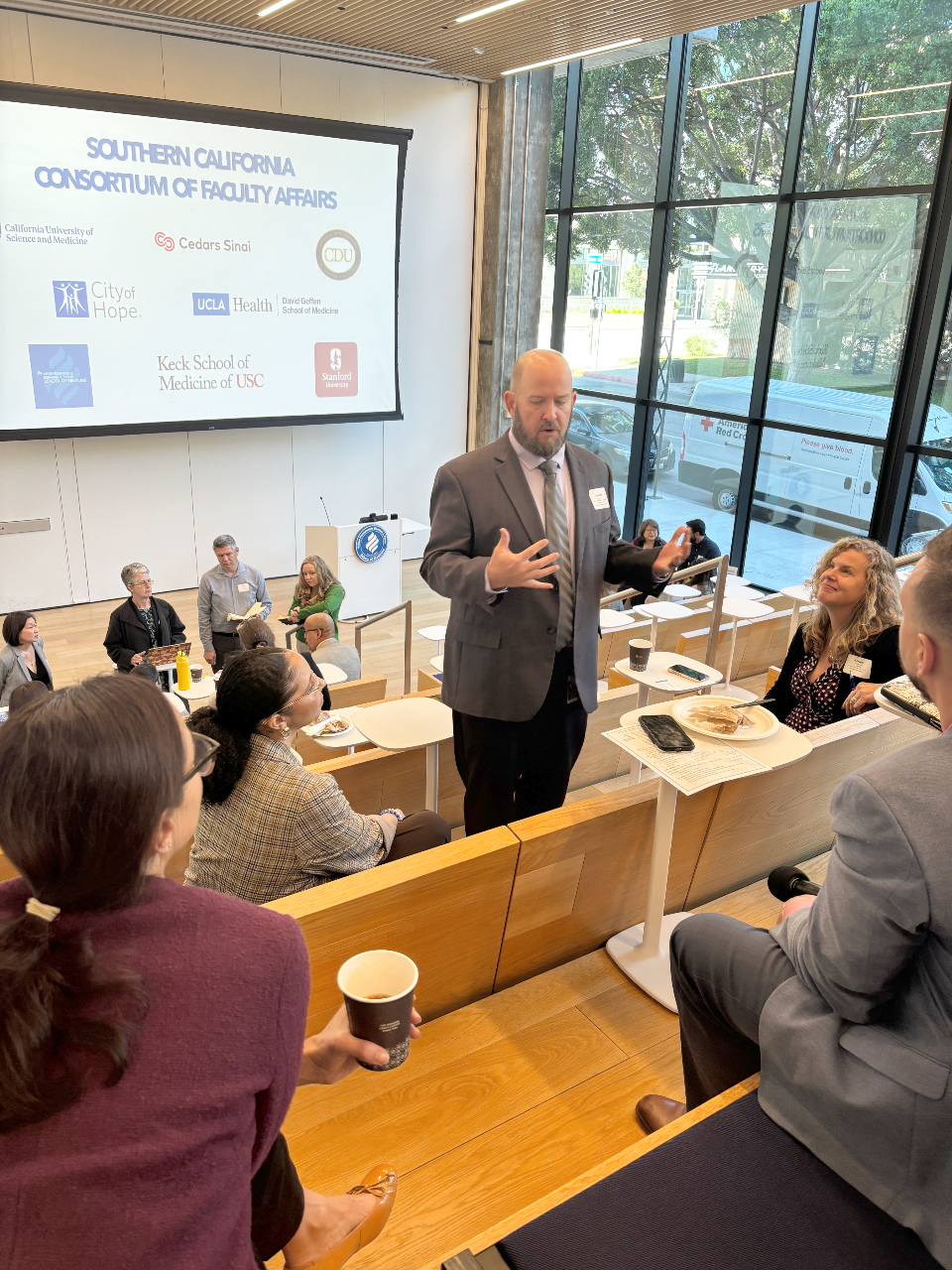 Jonathan Townsend, EdD, Director of Faculty and Professional Development at California University of Science and Medicine, speaks in a breakout discussion at the consortium.