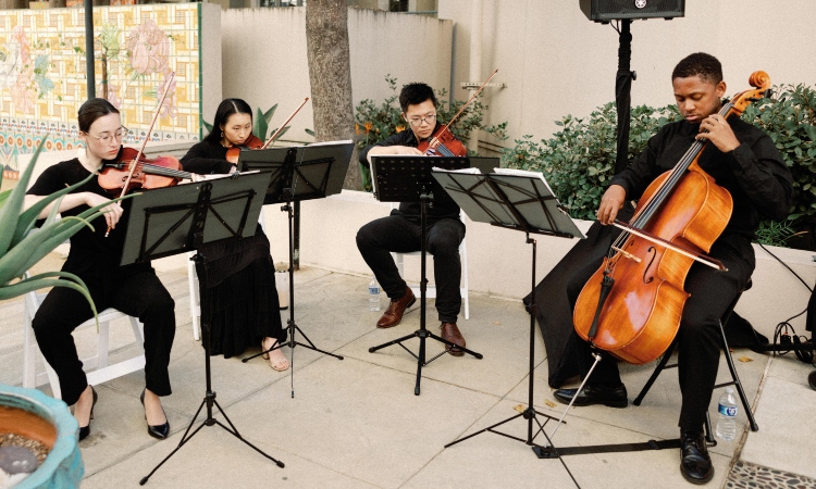 Members of the KPSOM Student Orchestra performing at the wedding of Vicky Quach, KPSOM Business Consultant in the Office of Faculty Affairs.